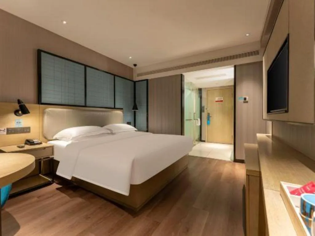 Bed in Echarm Hotel Wuhan Vanke Future Center Wulidun Metro Station