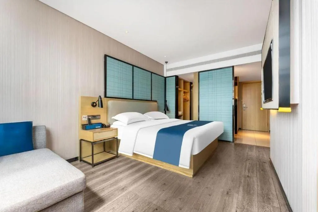 Bed in Echarm Hotel Wuhan Vanke Future Center Wulidun Metro Station