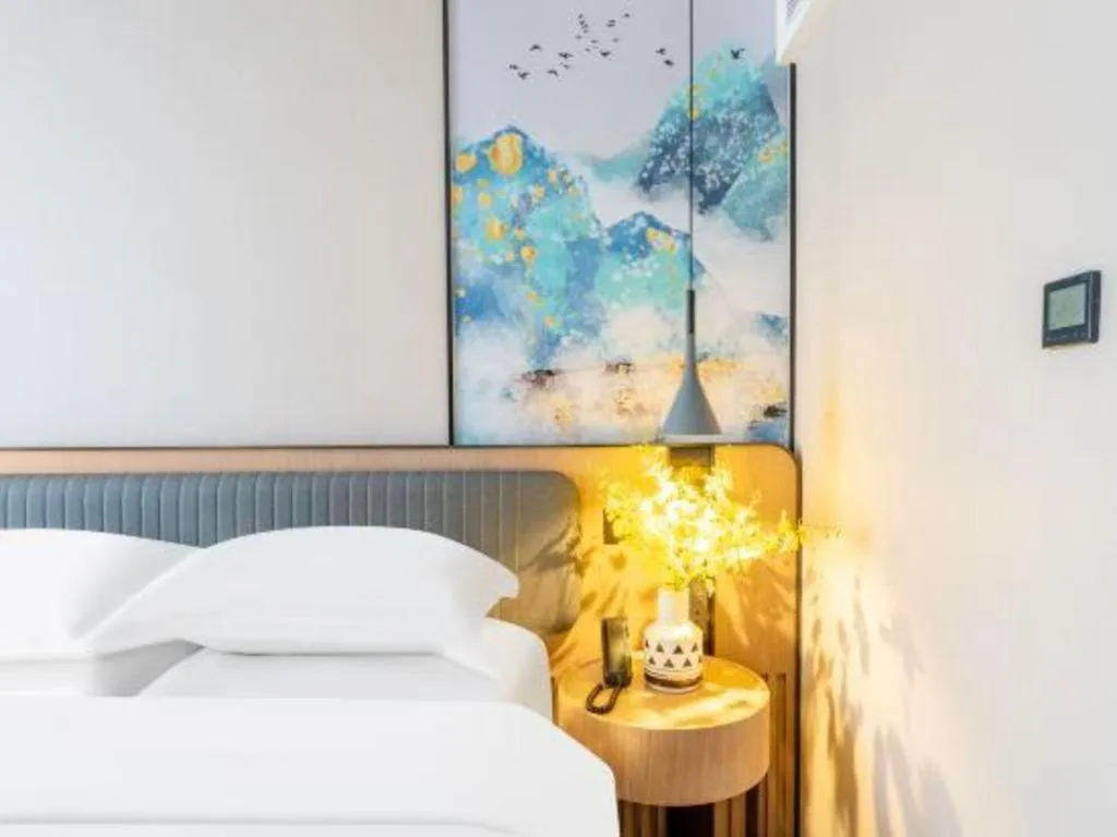 Bed in Echarm Hotel Wuhan Vanke Future Center Wulidun Metro Station