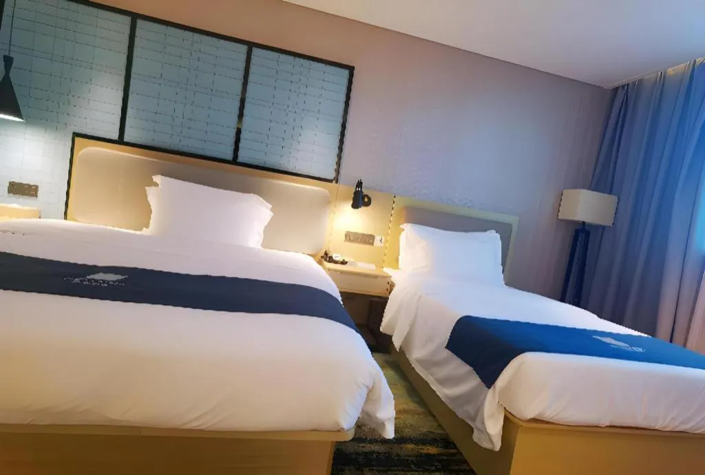 Bed in Echarm Hotel Wuhan Vanke Future Center Wulidun Metro Station