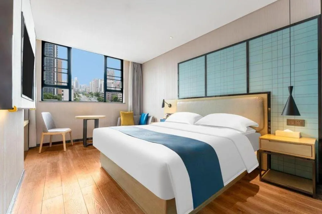 Bed in Echarm Hotel Wuhan Vanke Future Center Wulidun Metro Station