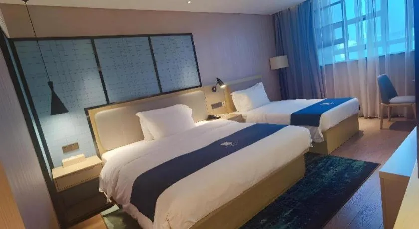 Bed in Echarm Hotel Wuhan Vanke Future Center Wulidun Metro Station