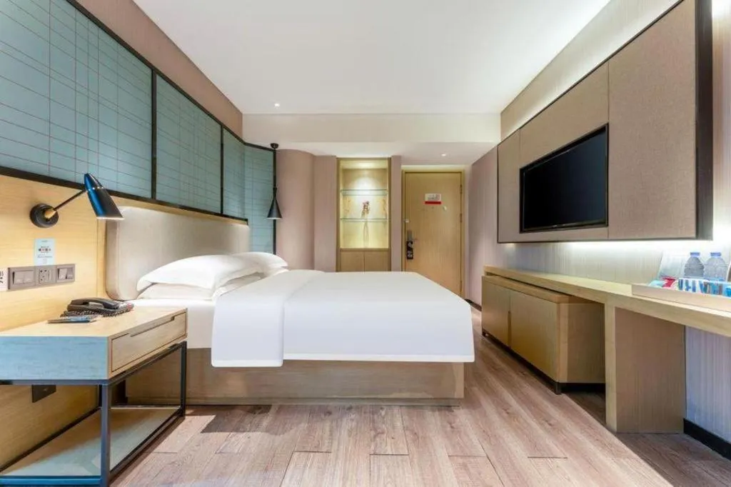 Bed in Echarm Hotel Wuhan Vanke Future Center Wulidun Metro Station