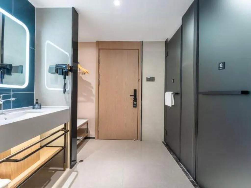 Bed in Echarm Hotel Wuhan Vanke Future Center Wulidun Metro Station