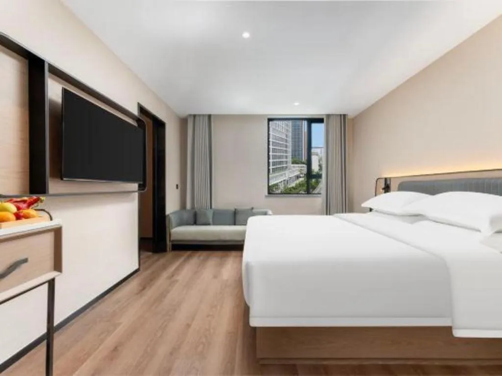 Bed in Echarm Hotel Wuhan Vanke Future Center Wulidun Metro Station