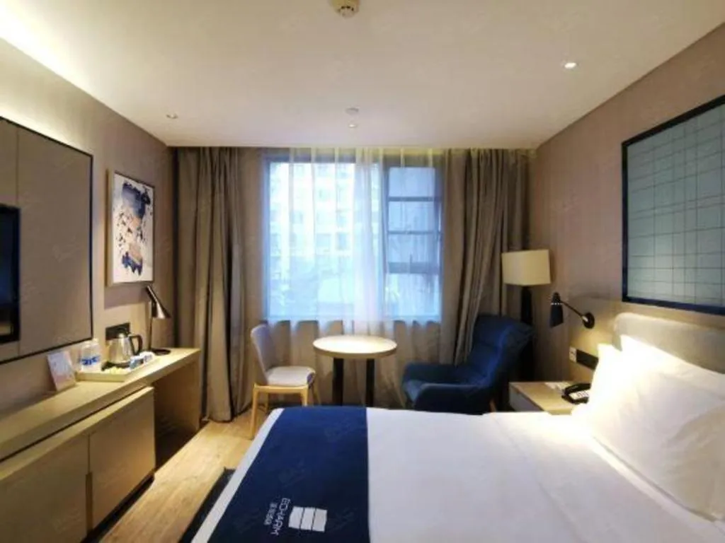 Bed in Echarm Hotel Wuhan Vanke Future Center Wulidun Metro Station