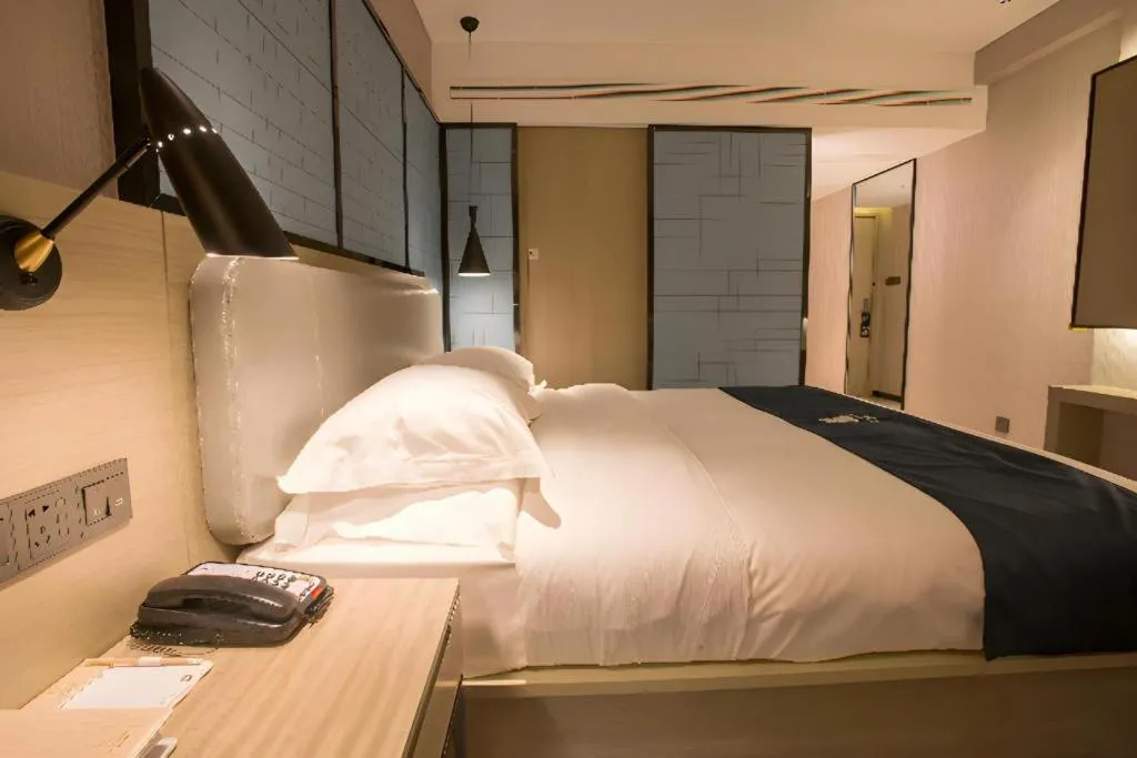 Bed in Echarm Hotel Wuhan Vanke Future Center Wulidun Metro Station