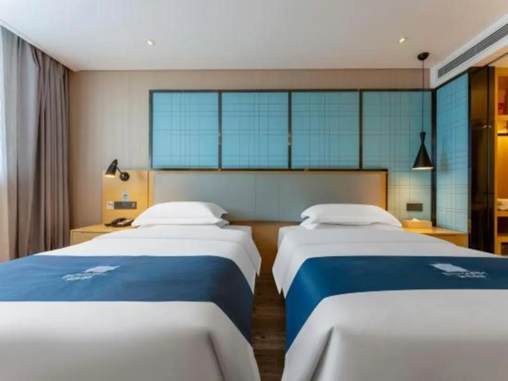 Bed in Echarm Hotel Wuhan Vanke Future Center Wulidun Metro Station