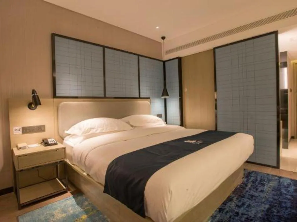 Bed in Echarm Hotel Wuhan Vanke Future Center Wulidun Metro Station