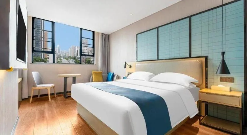 Bed in Echarm Hotel Wuhan Vanke Future Center Wulidun Metro Station