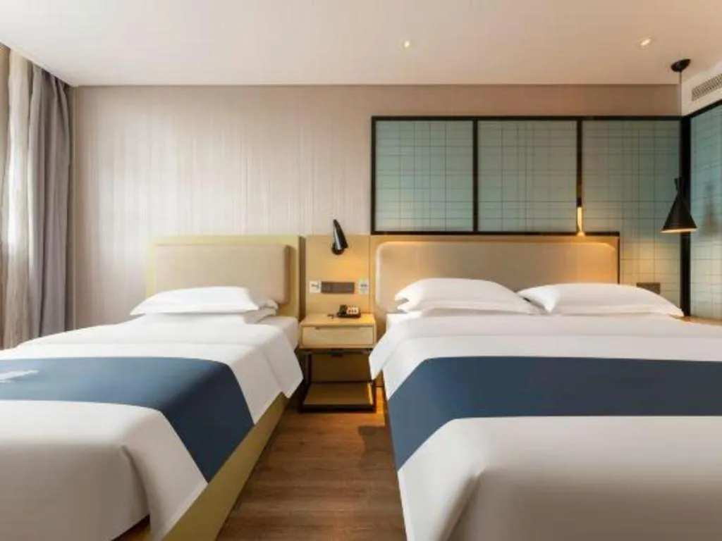 Bed in Echarm Hotel Wuhan Vanke Future Center Wulidun Metro Station