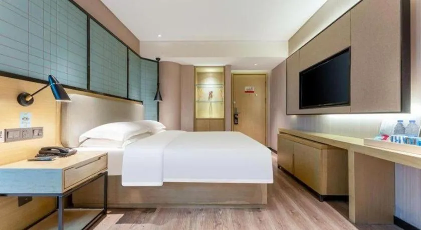 Bed in Echarm Hotel Wuhan Vanke Future Center Wulidun Metro Station
