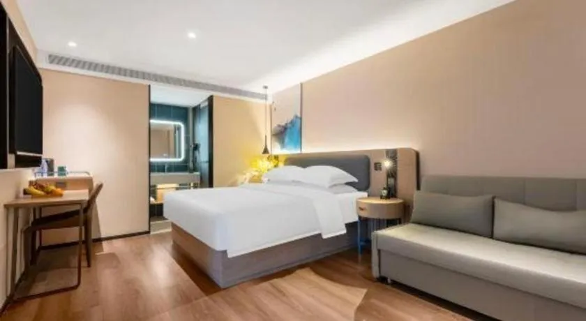 Bed in Echarm Hotel Wuhan Vanke Future Center Wulidun Metro Station