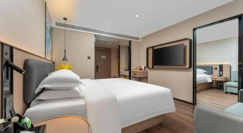 Bed in Echarm Hotel Wuhan Vanke Future Center Wulidun Metro Station