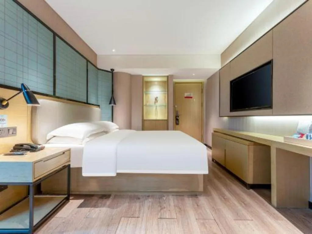 Bed in Echarm Hotel Wuhan Vanke Future Center Wulidun Metro Station