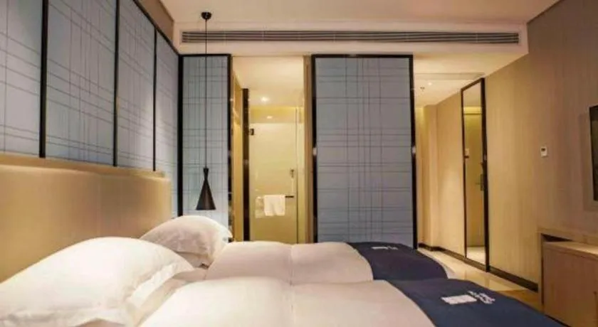 Bed in Echarm Hotel Wuhan Vanke Future Center Wulidun Metro Station