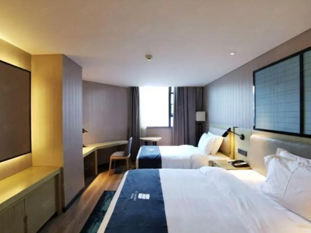 Bed in Echarm Hotel Wuhan Vanke Future Center Wulidun Metro Station