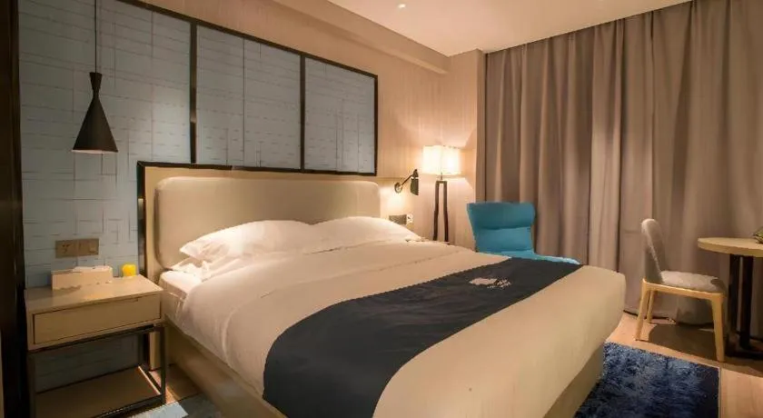 Bed in Echarm Hotel Wuhan Vanke Future Center Wulidun Metro Station
