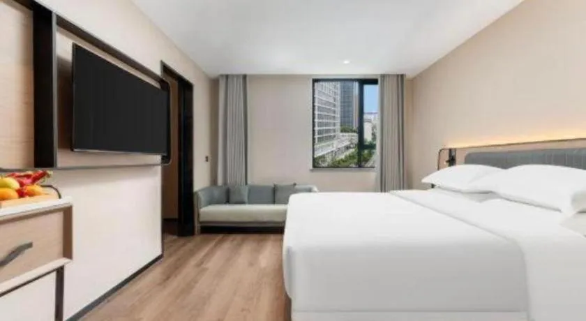 Bed in Echarm Hotel Wuhan Vanke Future Center Wulidun Metro Station