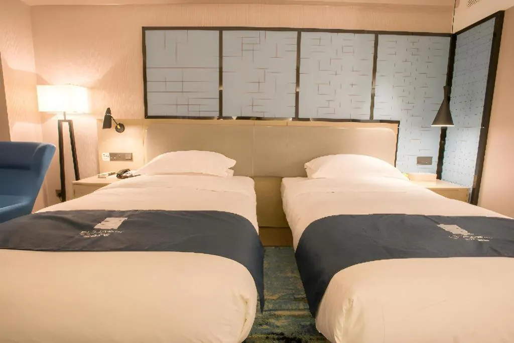 Bed in Echarm Hotel Wuhan Vanke Future Center Wulidun Metro Station