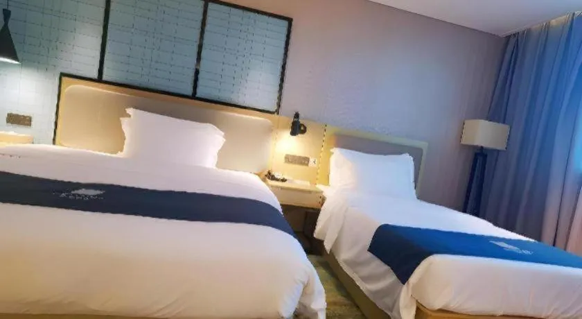 Bed in Echarm Hotel Wuhan Vanke Future Center Wulidun Metro Station