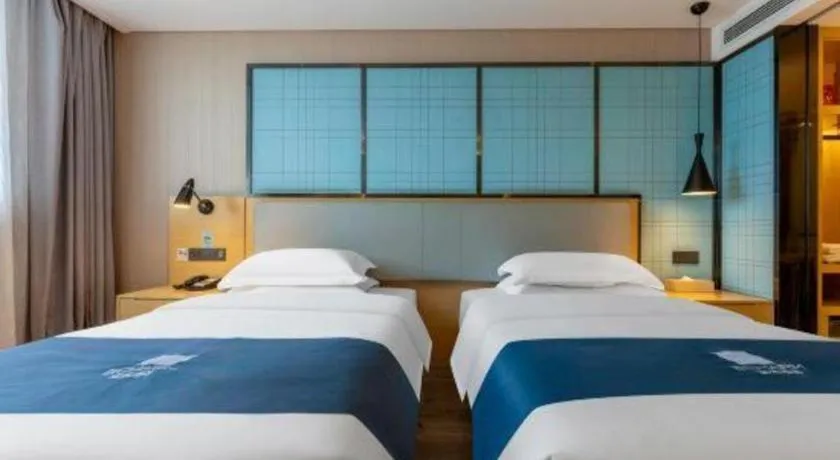 Bed in Echarm Hotel Wuhan Vanke Future Center Wulidun Metro Station