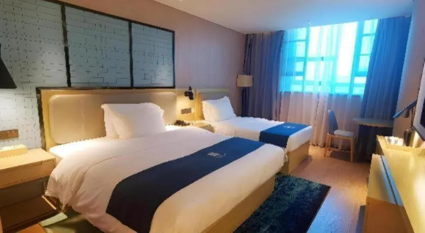 Bed in Echarm Hotel Wuhan Vanke Future Center Wulidun Metro Station