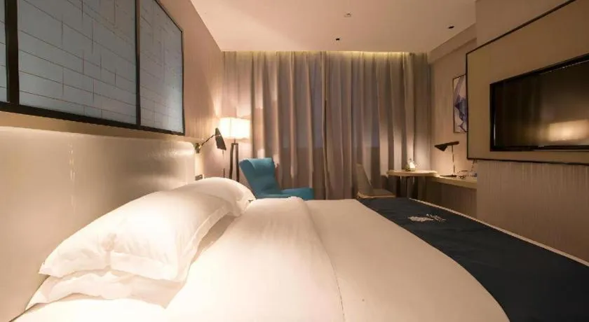 Bed in Echarm Hotel Wuhan Vanke Future Center Wulidun Metro Station