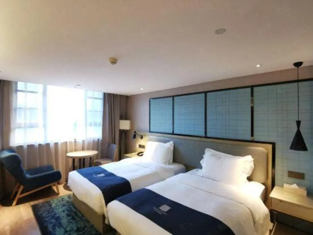 Bed in Echarm Hotel Wuhan Vanke Future Center Wulidun Metro Station