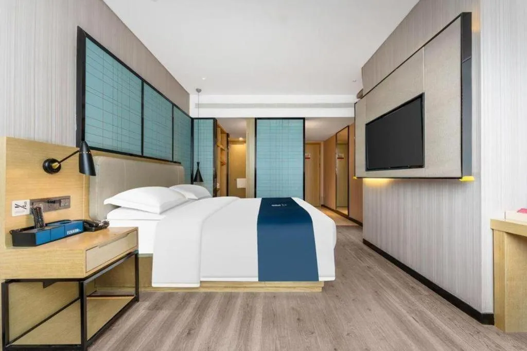 Bed in Echarm Hotel Wuhan Vanke Future Center Wulidun Metro Station