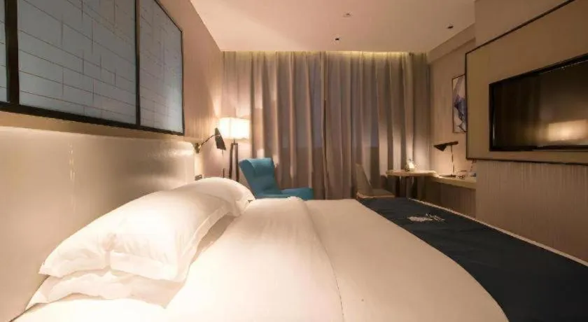 Bed in Echarm Hotel Wuhan Vanke Future Center Wulidun Metro Station