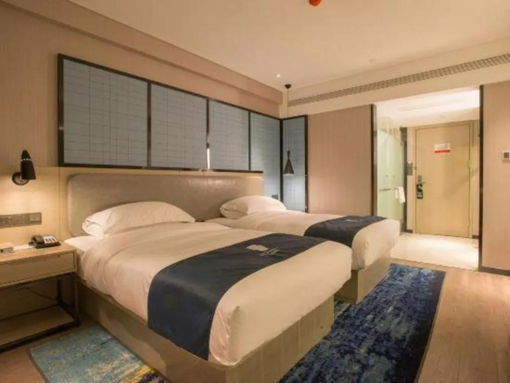 Bed in Echarm Hotel Wuhan Vanke Future Center Wulidun Metro Station