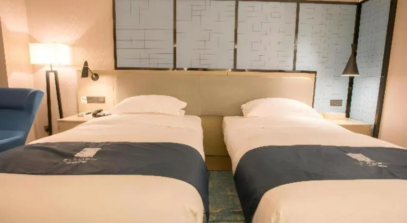 Bed in Echarm Hotel Wuhan Vanke Future Center Wulidun Metro Station