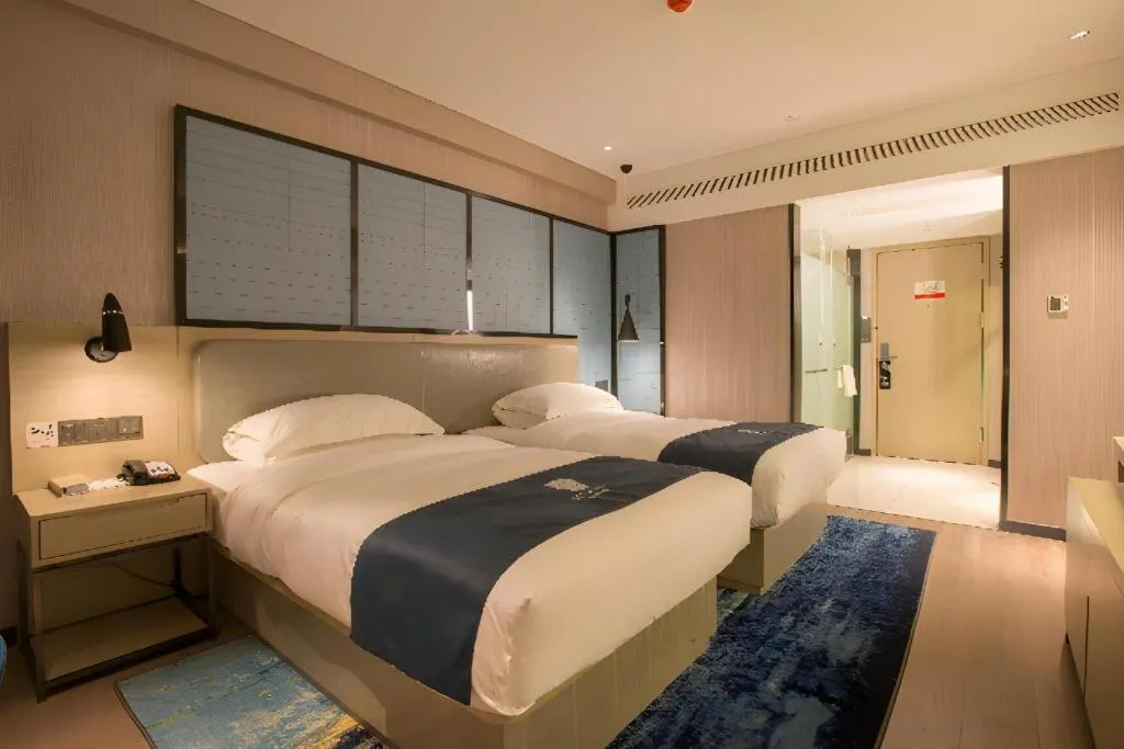 Bed in Echarm Hotel Wuhan Vanke Future Center Wulidun Metro Station