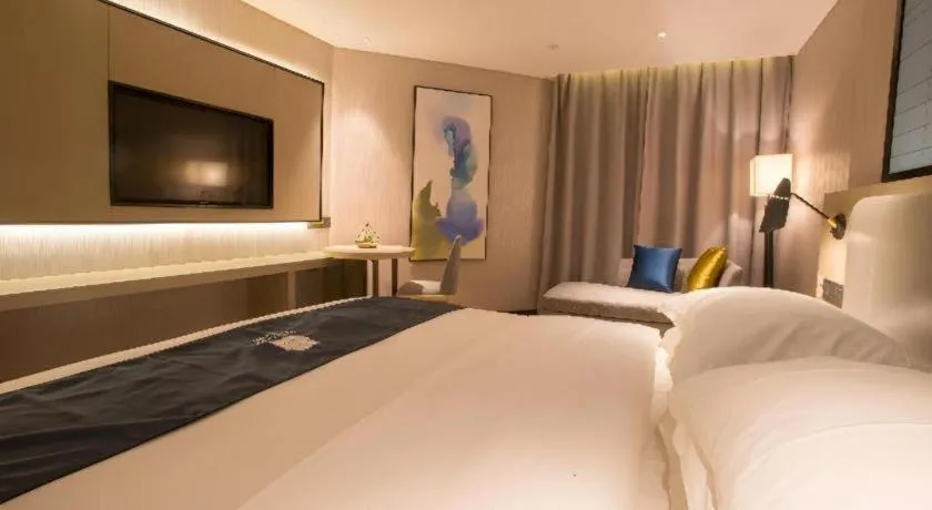 Bed in Echarm Hotel Wuhan Vanke Future Center Wulidun Metro Station