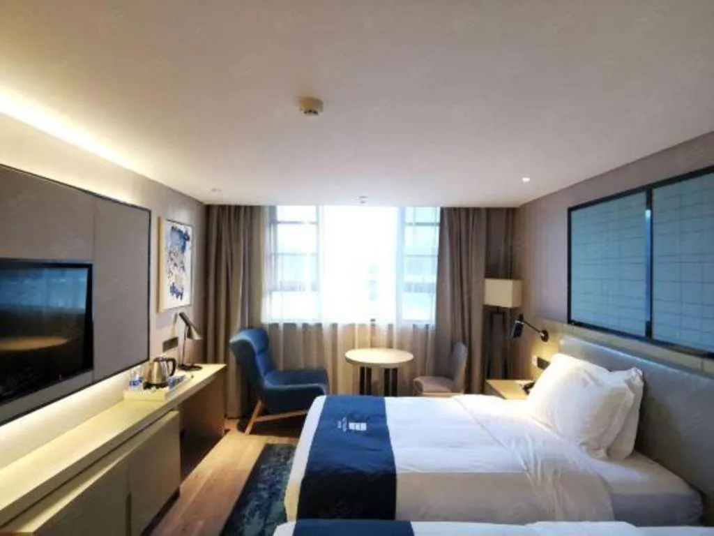 Bed in Echarm Hotel Wuhan Vanke Future Center Wulidun Metro Station