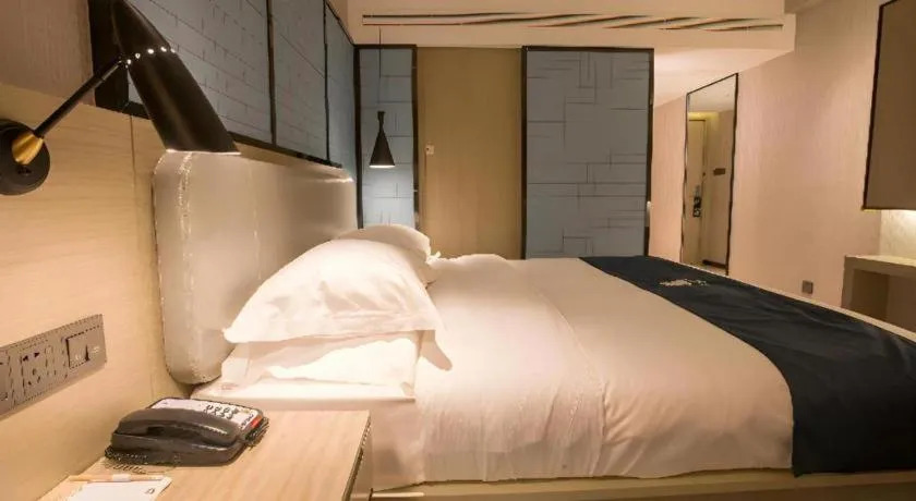 Bed in Echarm Hotel Wuhan Vanke Future Center Wulidun Metro Station