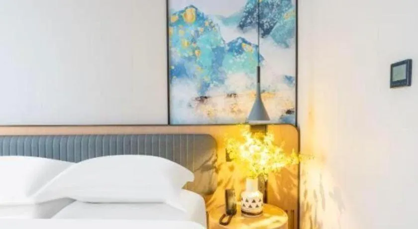 Bed in Echarm Hotel Wuhan Vanke Future Center Wulidun Metro Station