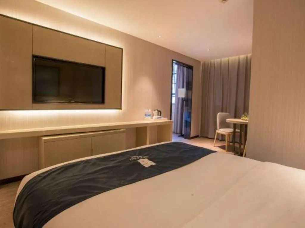 Bed in Echarm Hotel Wuhan Vanke Future Center Wulidun Metro Station