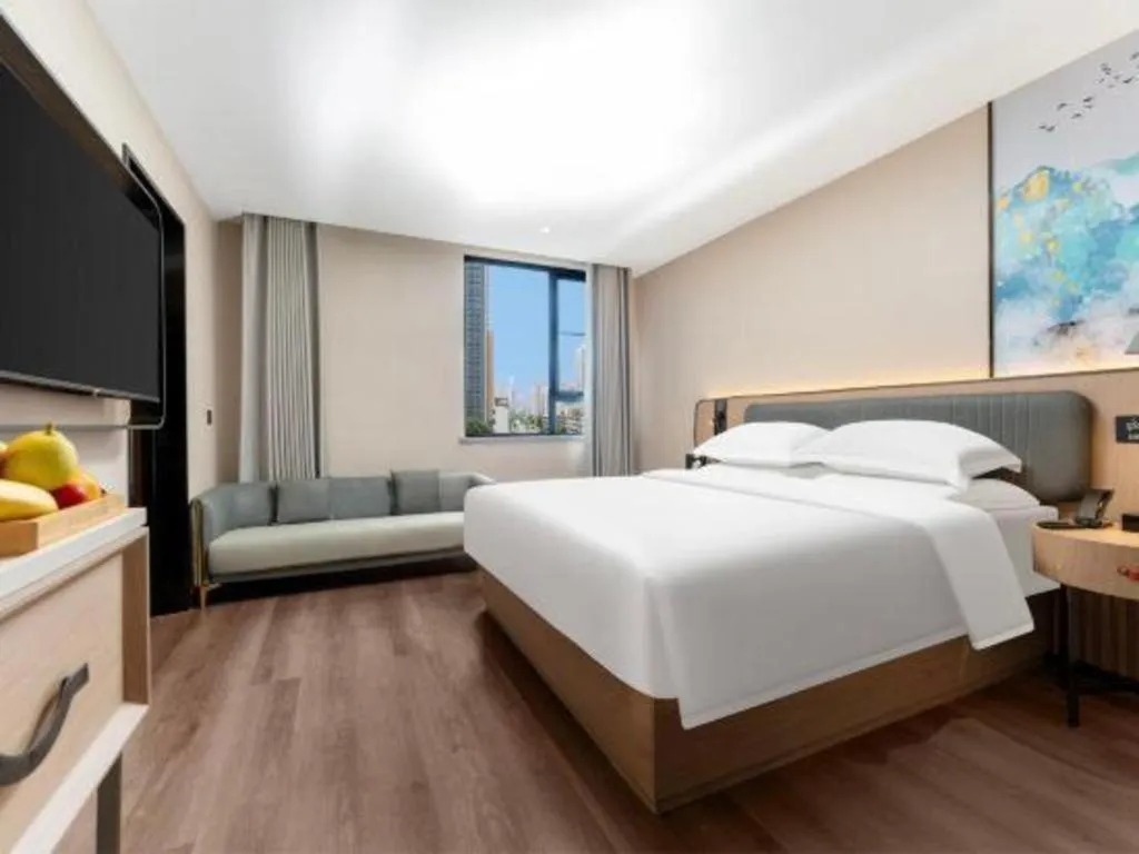 Bed in Echarm Hotel Wuhan Vanke Future Center Wulidun Metro Station