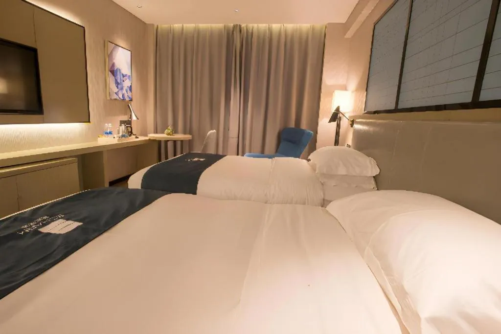 Bed in Echarm Hotel Wuhan Vanke Future Center Wulidun Metro Station