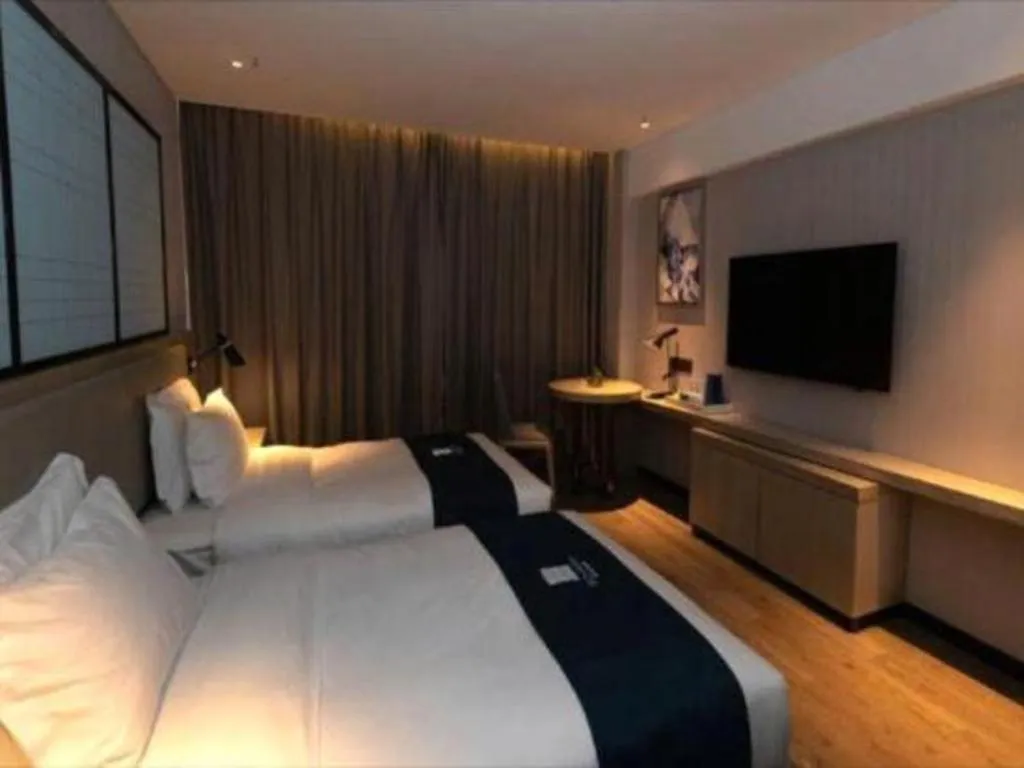 Bed in Echarm Hotel Zibo Gaoqing Zhongcheng Inernational