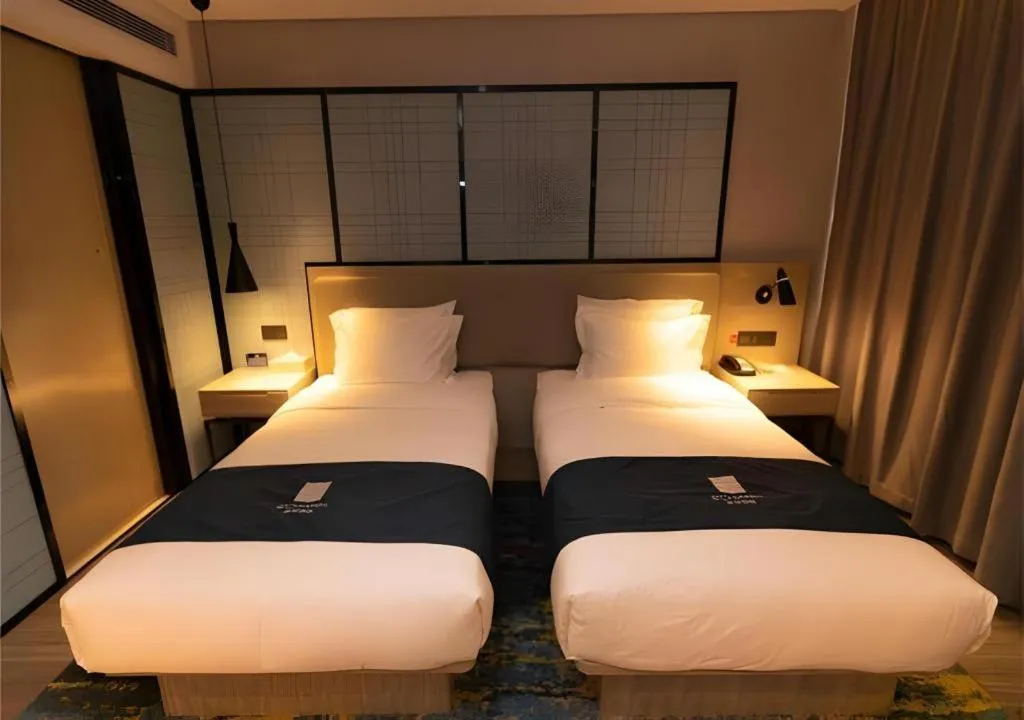 Bed in Echarm Hotel Zibo Gaoqing Zhongcheng Inernational