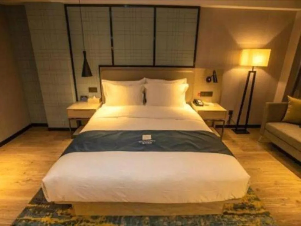 Bed in Echarm Hotel Zibo Gaoqing Zhongcheng Inernational