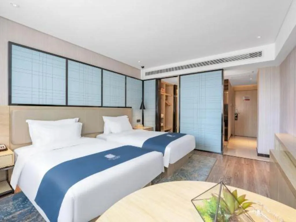 Bed in Echarm Hotel Zibo Gaoqing Zhongcheng Inernational