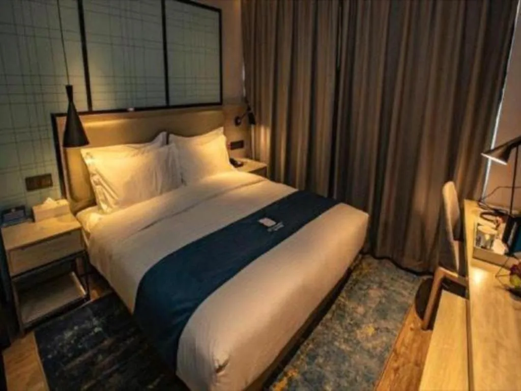 Bed in Echarm Hotel Zibo Gaoqing Zhongcheng Inernational