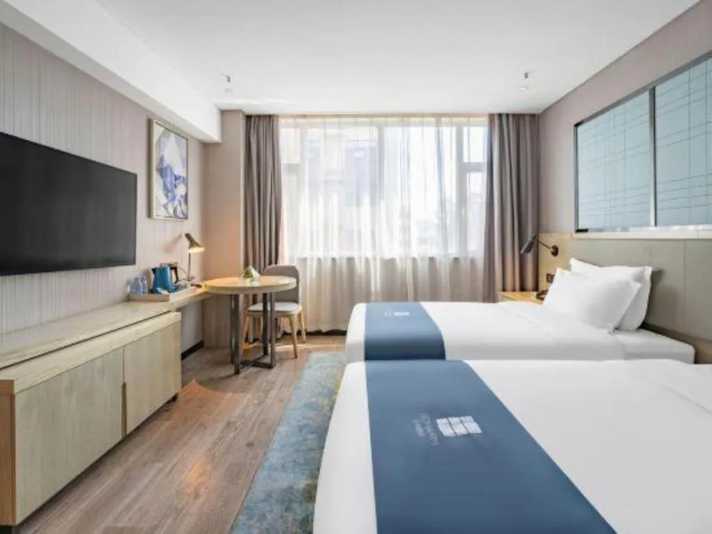 Bed in Echarm Hotel Zibo Gaoqing Zhongcheng Inernational