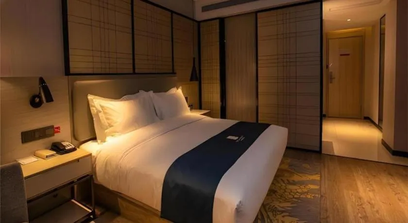 Bed in Echarm Hotel Zibo Gaoqing Zhongcheng Inernational