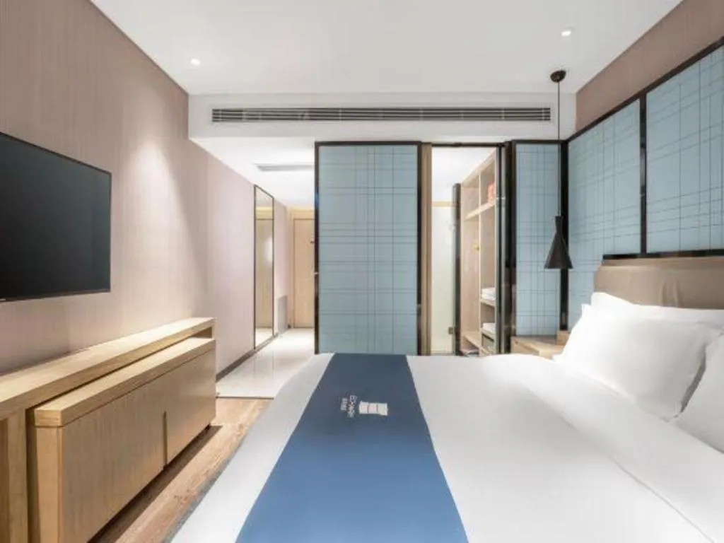 Bed in Echarm Hotel Zibo Gaoqing Zhongcheng Inernational