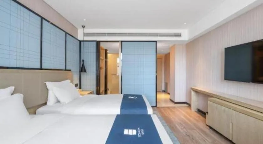 Bed in Echarm Hotel Zibo Gaoqing Zhongcheng Inernational